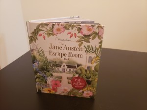 The Jane Austen Escape Room Book with a floral book cover and a house.
