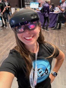 Theresa wearing a REA t-shirt and a nifty vr headset.