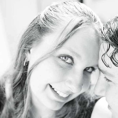 Christina smiling into the camera with her forehead touching Kurtis'.