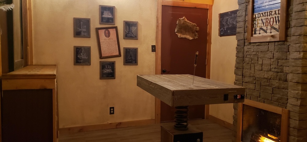 A table with a dagger stick into the tabletop.