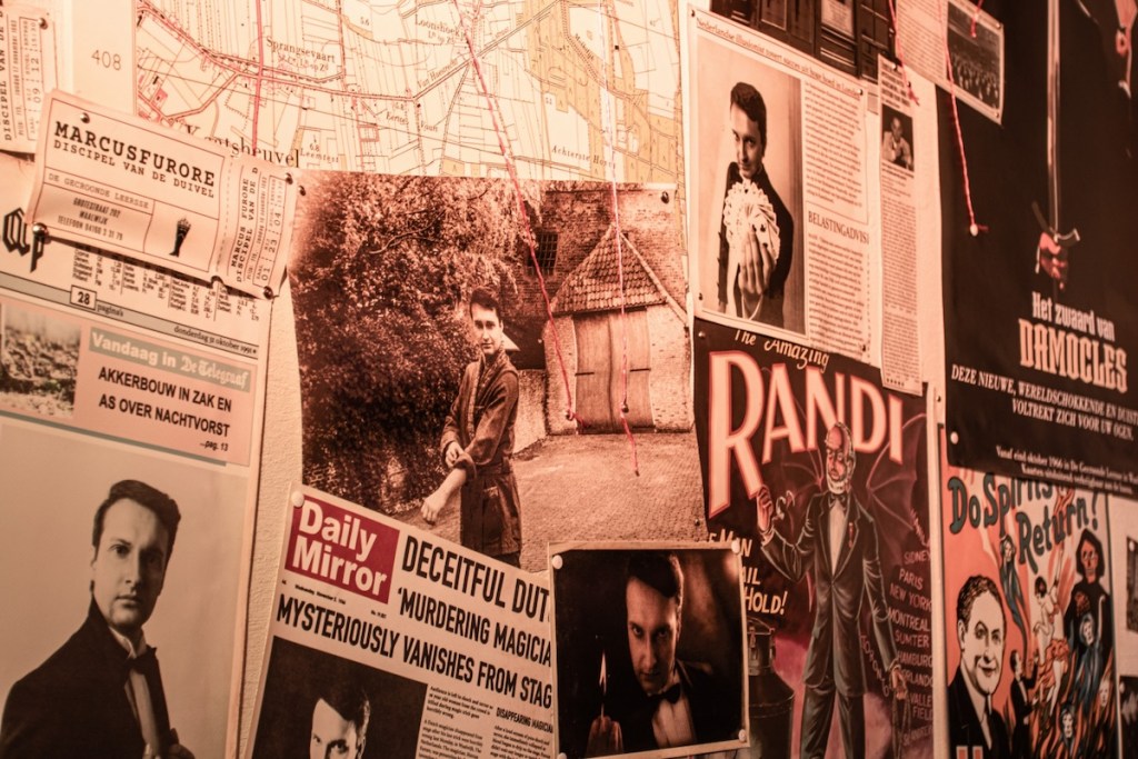 A wall of posters of a famous magician