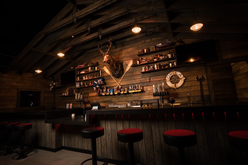 rustic bar with a mounted deer head.