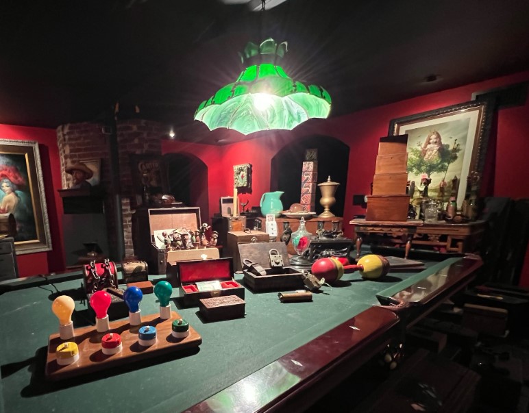 collection of puzzle and lock components displayed on a pool table