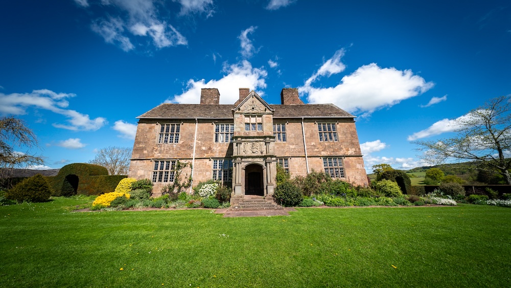 The exterior of a beautiful, old manor house in the Welsh countryside.