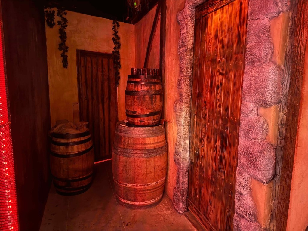 A storage area with barrels in an old tavern.