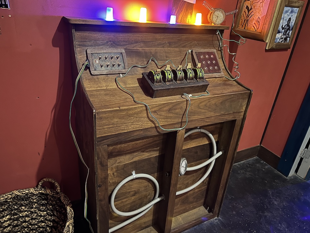 An unusual, steam-punkish contraptions with, an assortment of buttons lights, and switches.