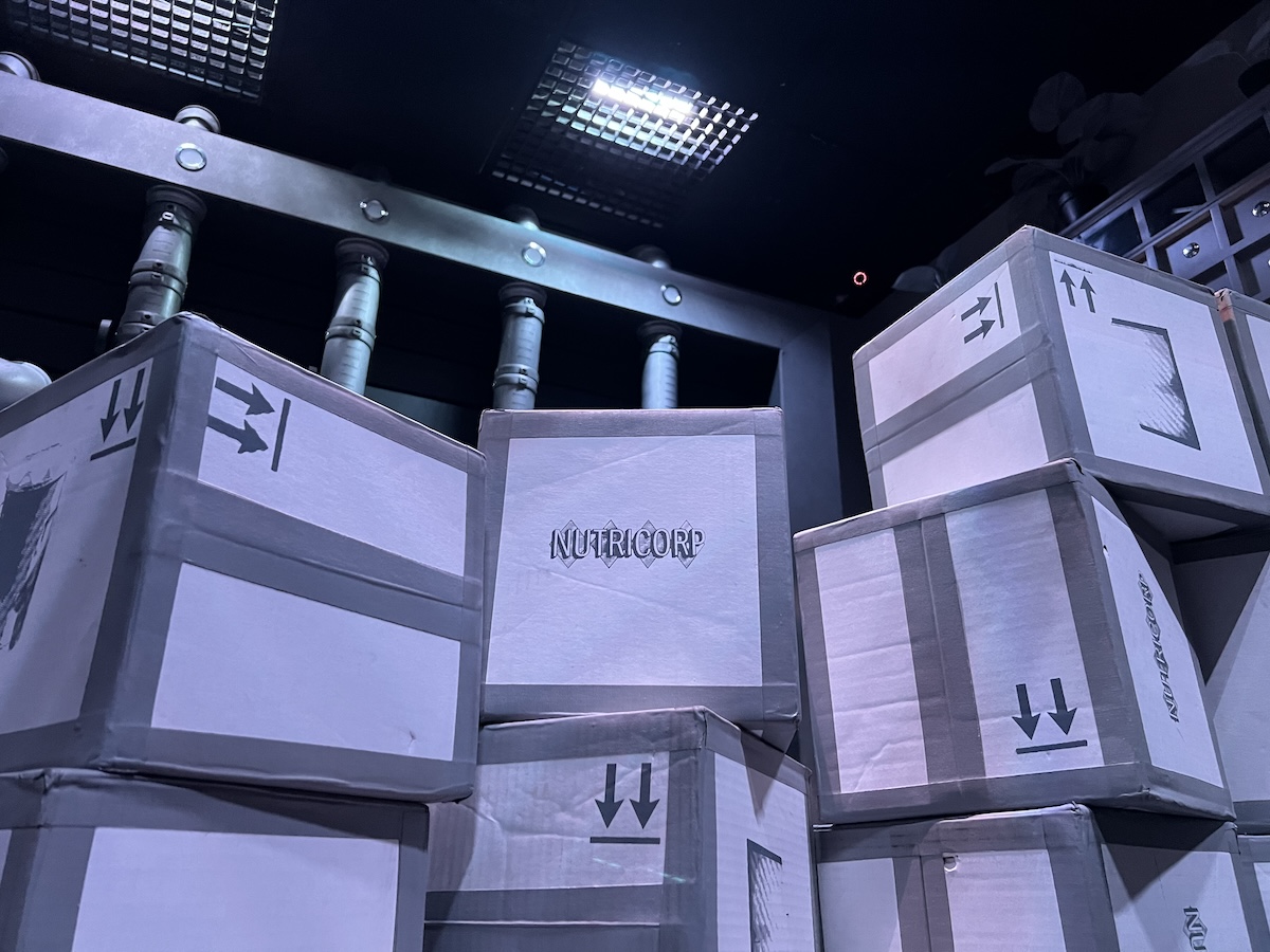 A stack of black and white boxes labeled "Nutricorp."