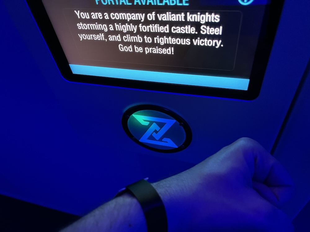 Wrist with a wristband checking into a Time Mission game.