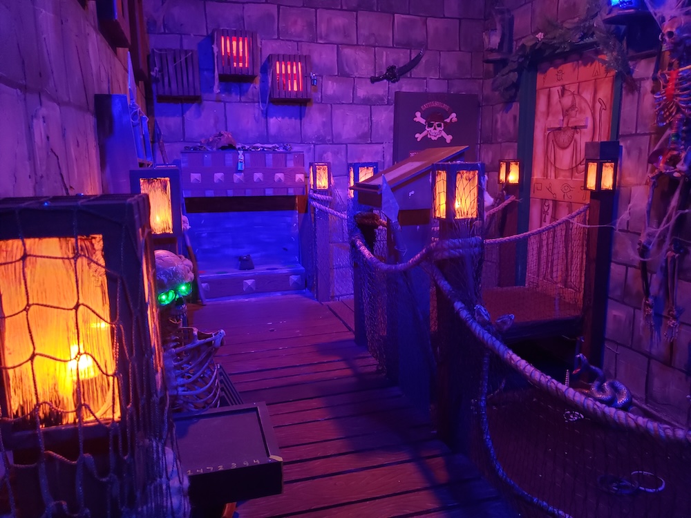 A stone walled tomb with a pirate theme.