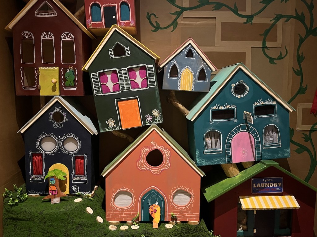 7 tiny houses and businesses in a fantastical puppet world.