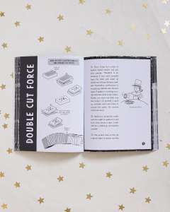 book open to instructions for performing the double cut force magic trick