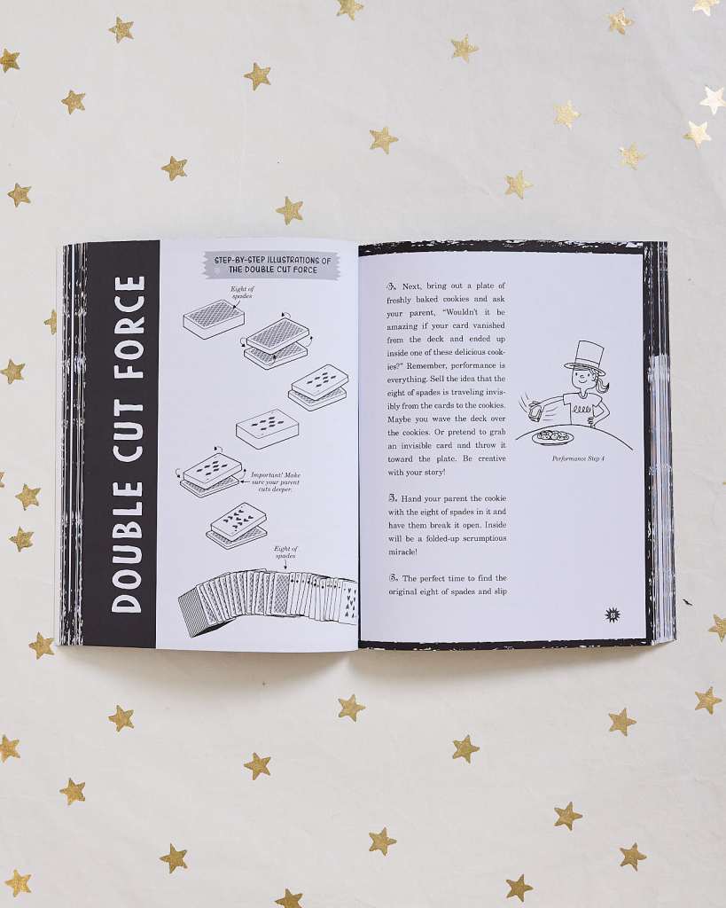 book open to instructions for performing the double cut force magic trick