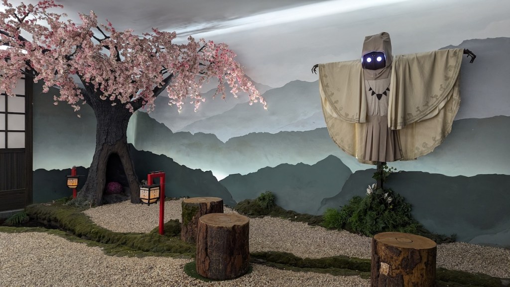 A cherry blossom beside a supernatural creature with glowing eyes.