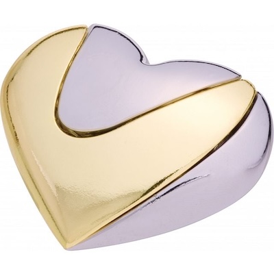 Cast metal heart made of two intertwined pieces, one gold, the other silver.