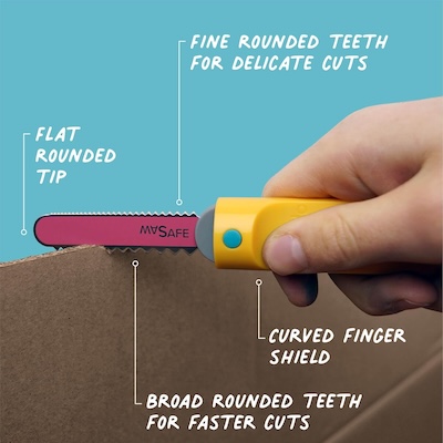A child's hand using a kid-friendly cardboard saw.