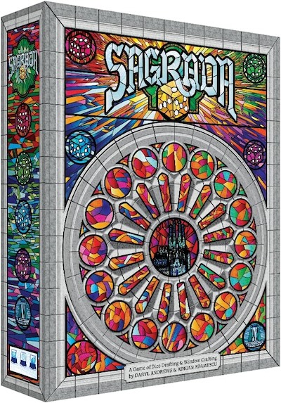 Sagrada game box covered in stained glass and dice.