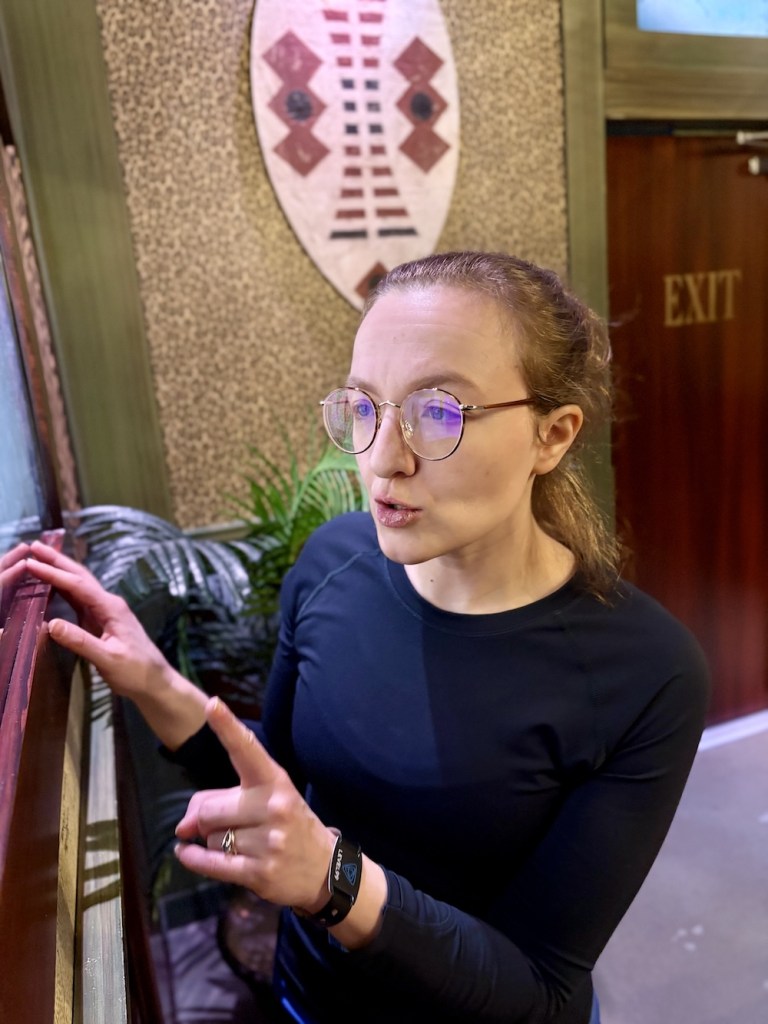 Lisa intensely solving a puzzle.