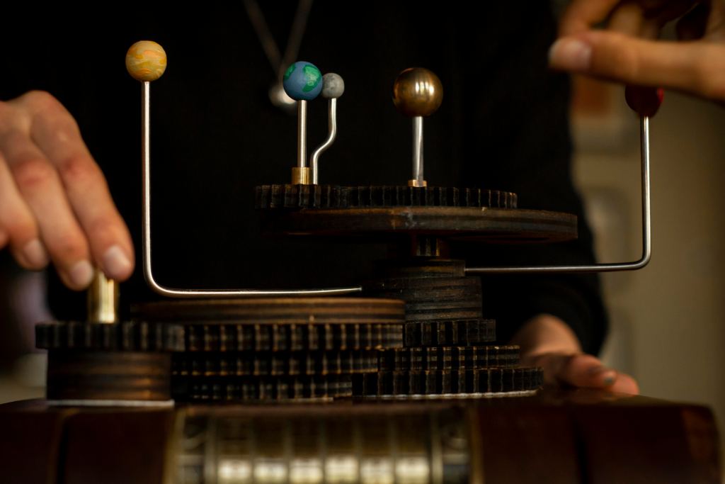 close up of solar system model with gears under