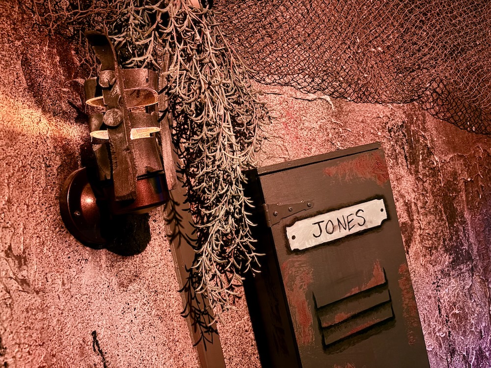 A locker labeled, "Jones" set against the wall of an ancient tomb.