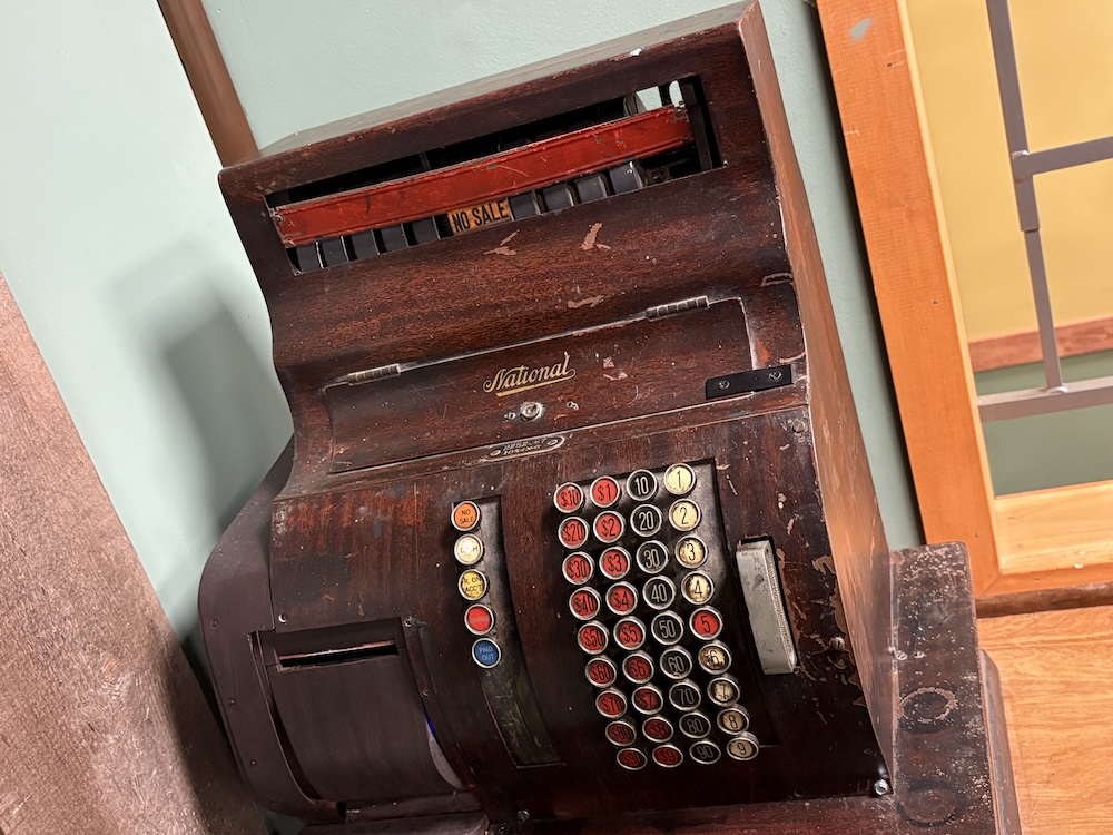 An old wooden cash register.