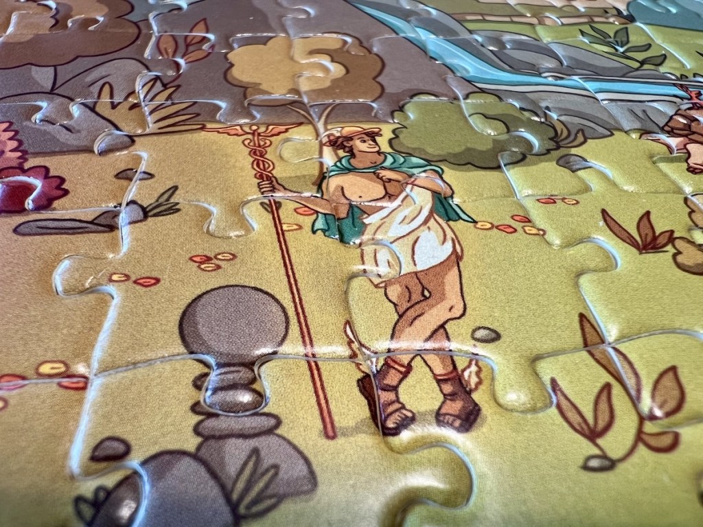 Closeup of an assembled jigsaw puzzle depicting the Greek god Hermes.