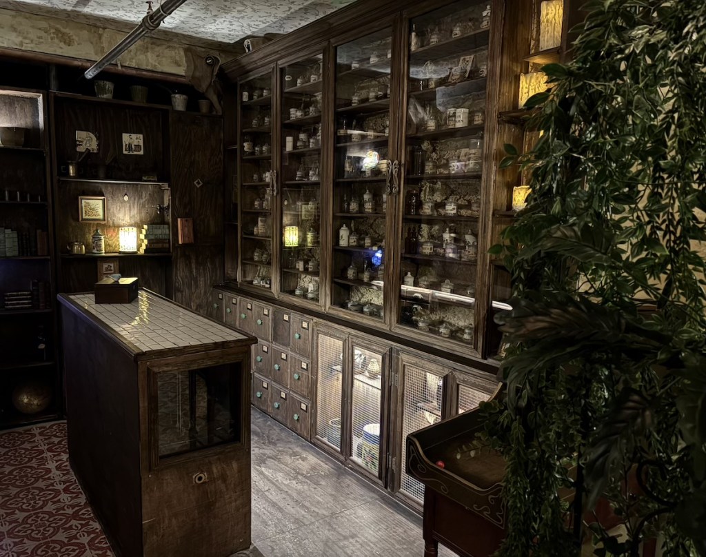 An alchemist's laboratory with shelves covered with ingredients.