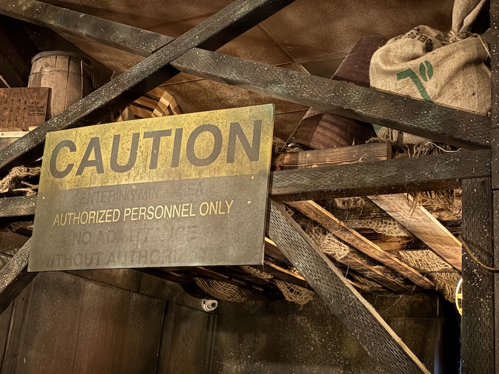A caution sign in a mineshaft.