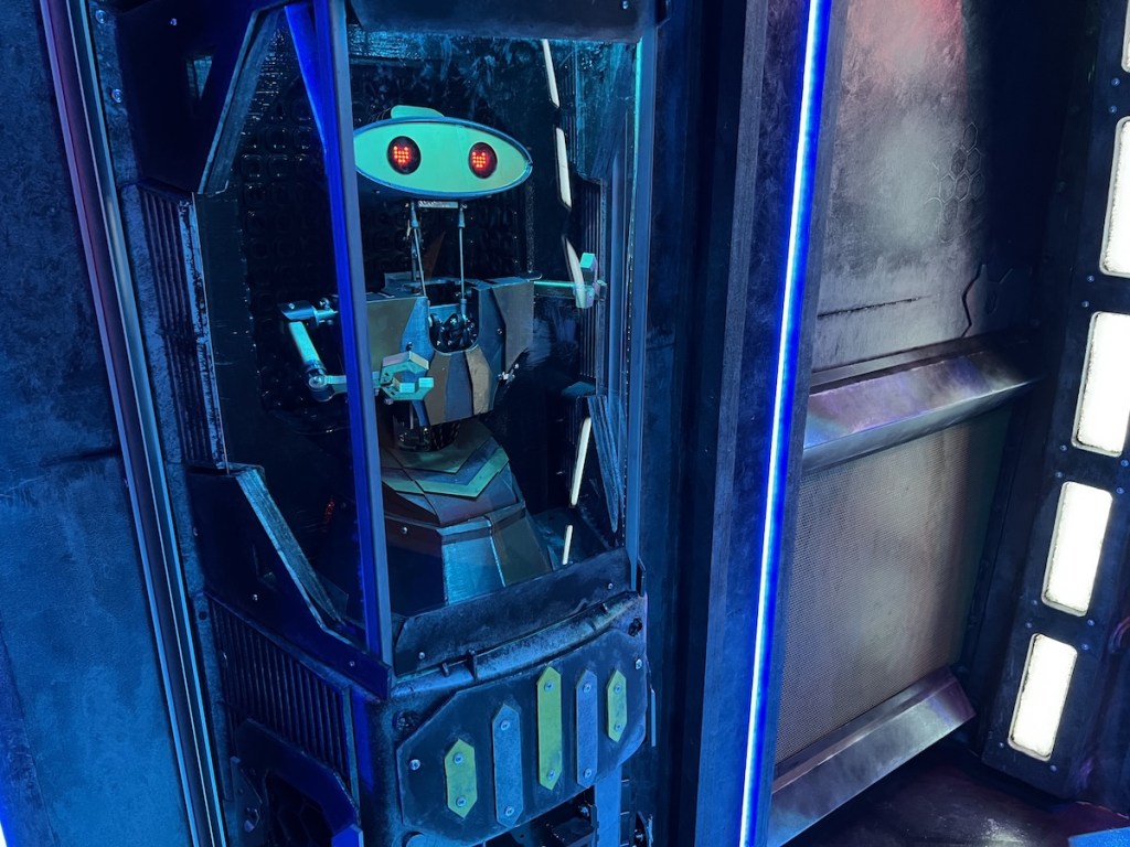 A robot with heart-shaped eyes aboard a spaceship.