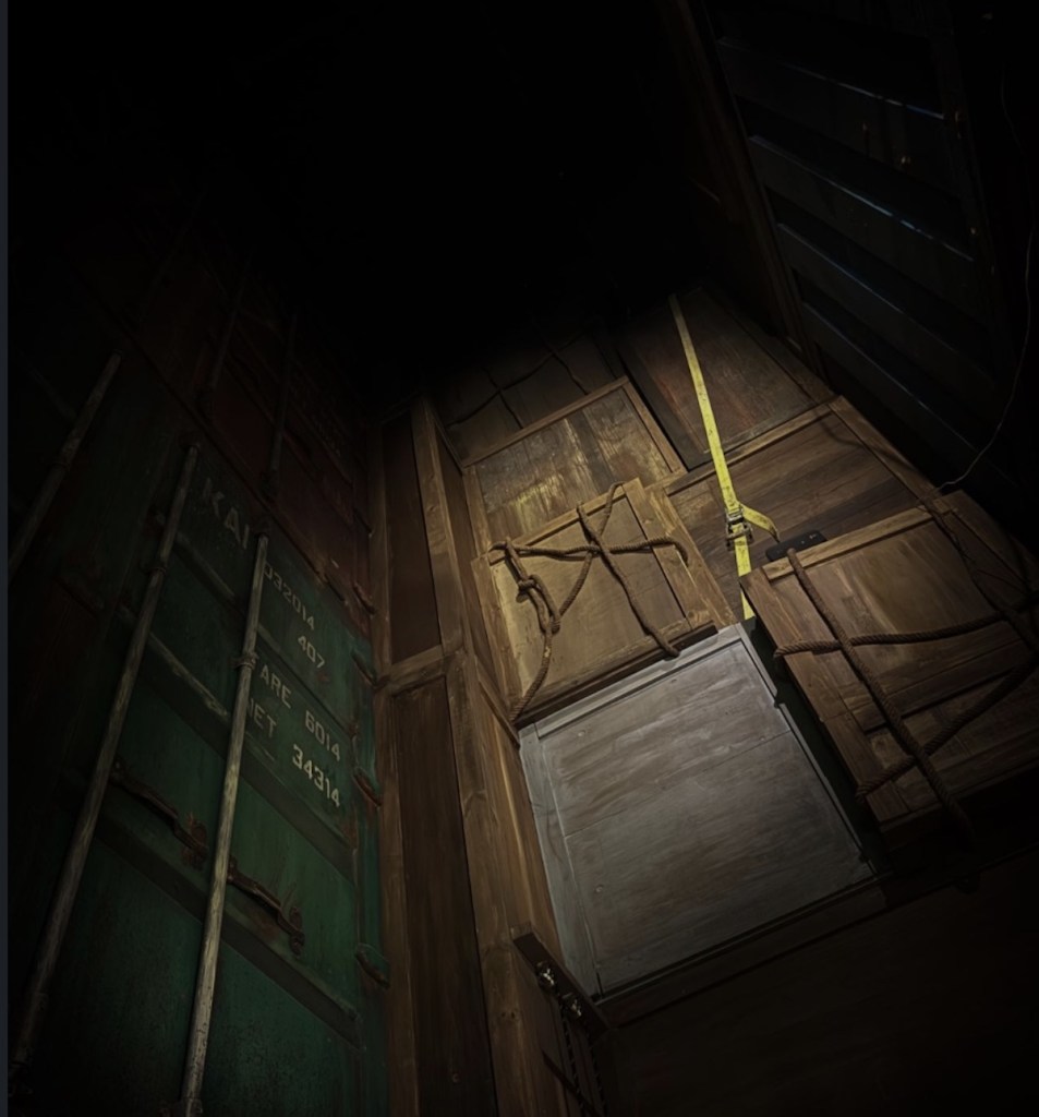 A large stack of crates and shipping containers.