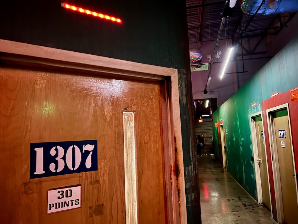 Door for Room 1307, labeled 30 points in a hallway full of game doors.