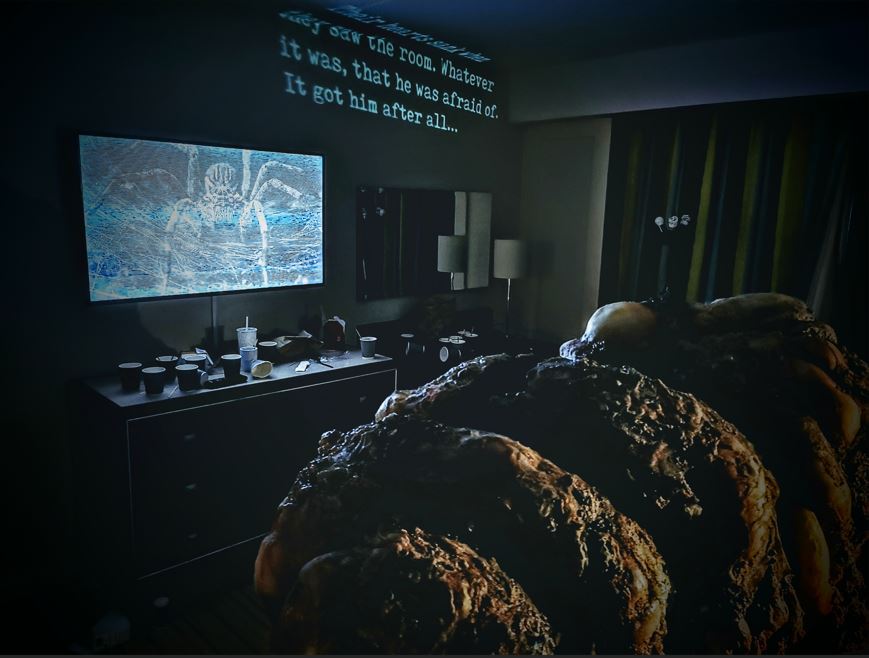a giant insectoid cocoon sac fills the room. there are creepy words projected on the walls, and on the television, there is a static filled image of a spider.