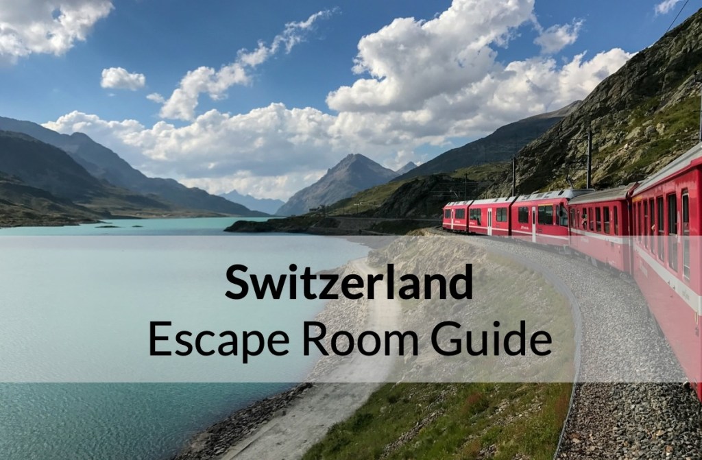 Reads: "Switzerland Escape Room Guide" Depicts a lake surrounded by mountains as a red train rolls by its banks.