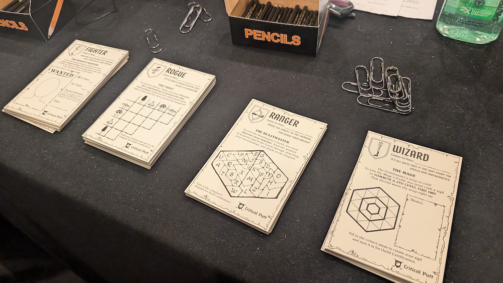 A table with player character cards including: fighter, rogue, ranger, and wizard.