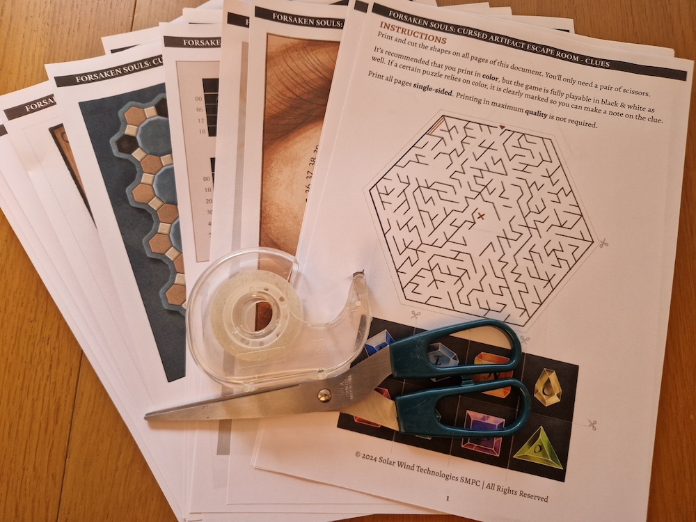 A stack of paper puzzle components with a pair of scissors and a roll of tape.