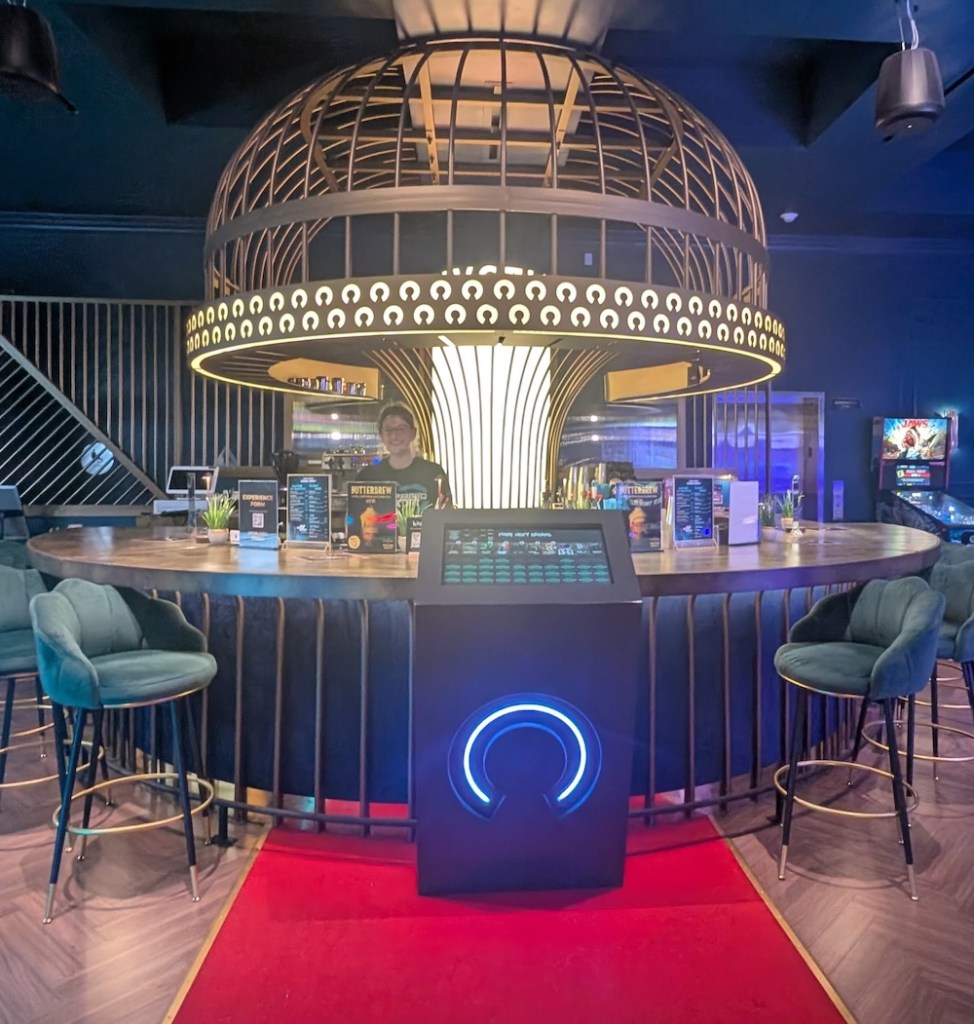 An ornate, art-deco style bar in functioning as the front desk to an escape room.