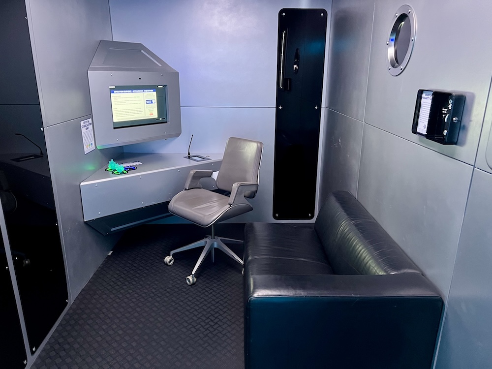 The Captain's Quarters of Bridge Command. Glowing rocks sit on the captain's desk.