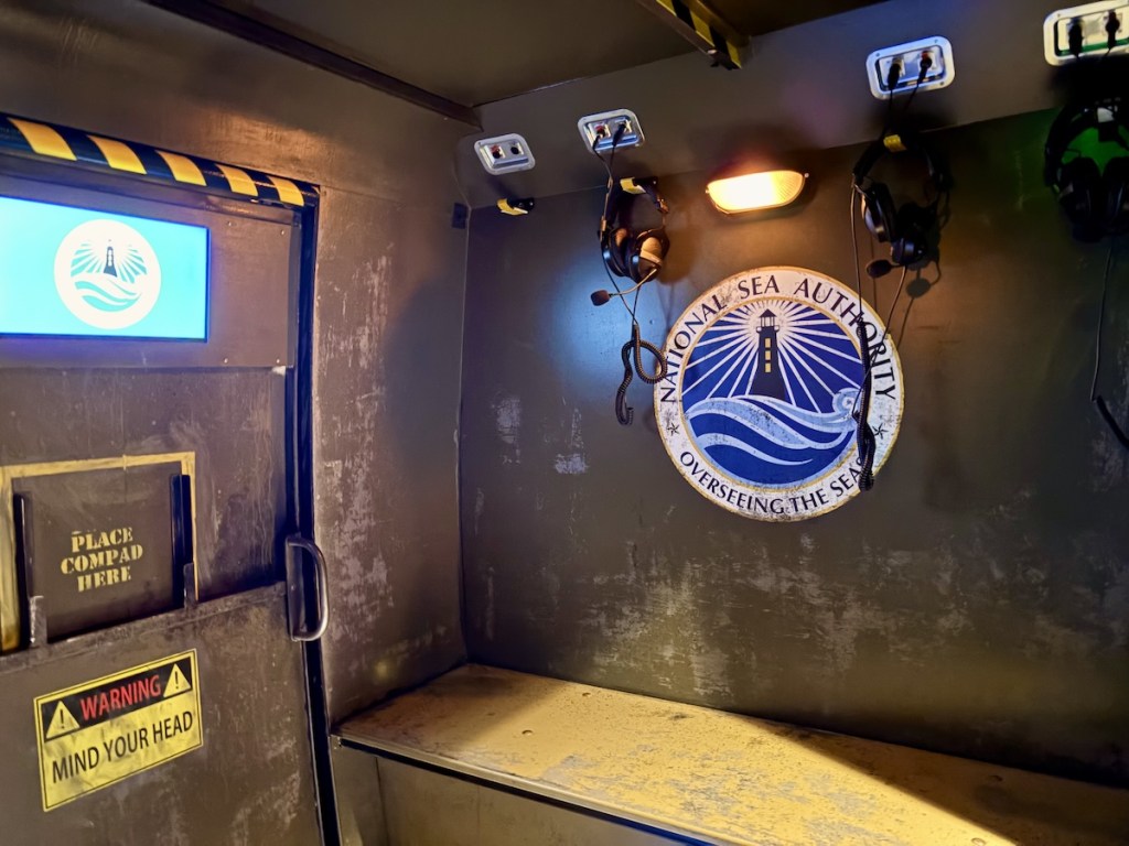 Interior of a helicopter for the National Sea Authority, a bench has headphones hanging from the wall above.