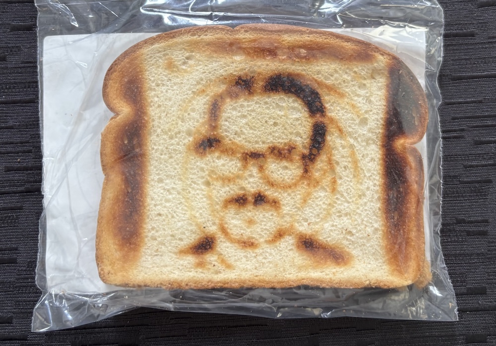 A piece of whitebread with David's bespectacled face burnt into it.  
