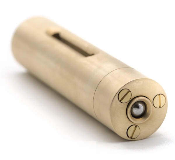 A brass piston with a ball bearing nested in the top.