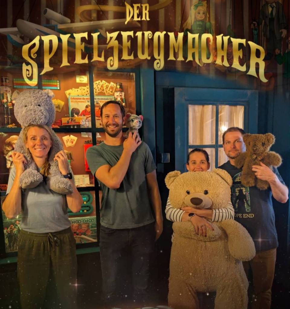 Post game photo from The Toymaker featuring Will and Kim Rutherford and Heather and Richard Burns all holding stuffed animals from the game
