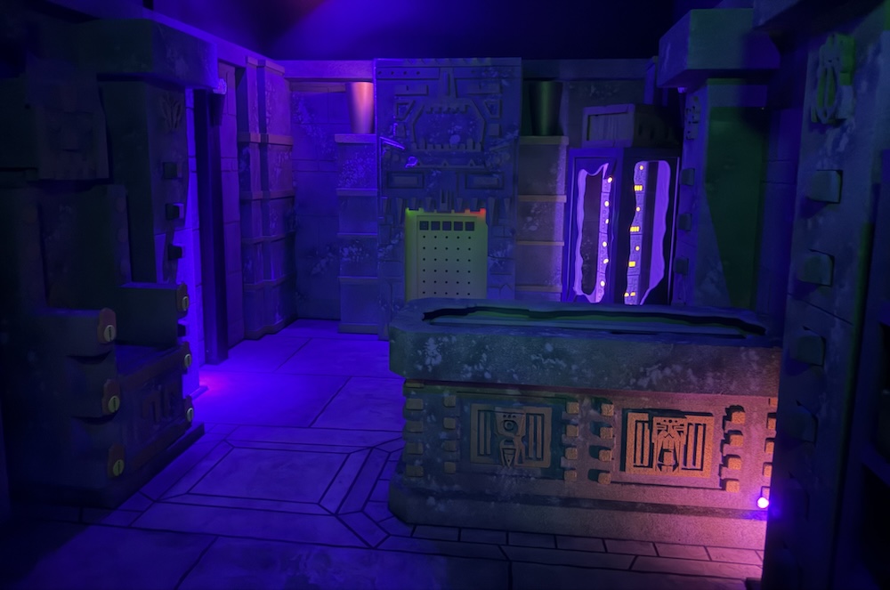 An ornate, and dramatically lit, ancient stone temple.