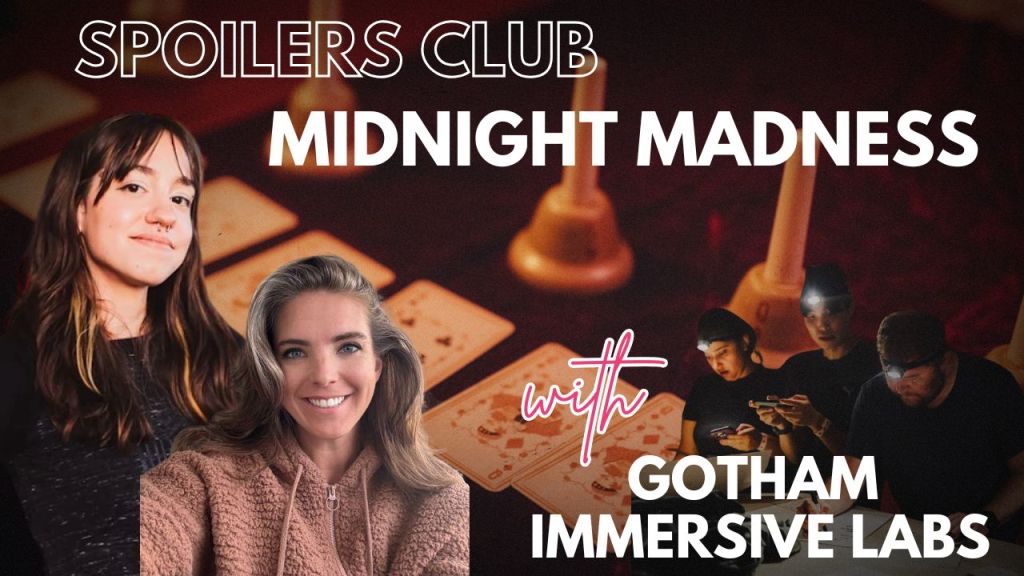 background of playing cards, woman in brown pullover and light brown hair smiling. behind her is another young woman with straight brown hair and a nose ring.