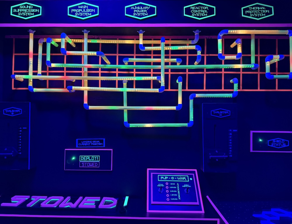 A grid covered in colorful, glowing tubes connecting different ship systems.