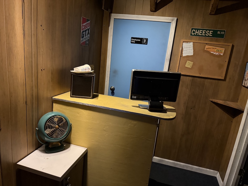 An old, wood-paneled office in a junkyard.