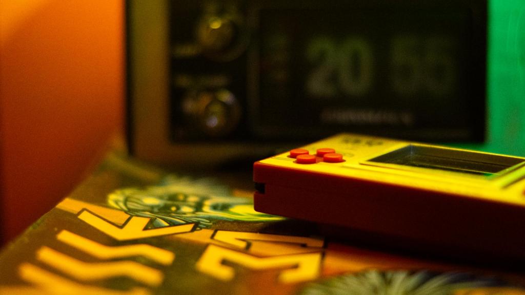 A video game console on top of a magazine