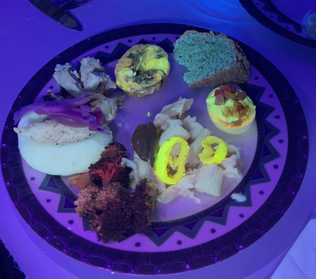 A plate of food that glows under black light.