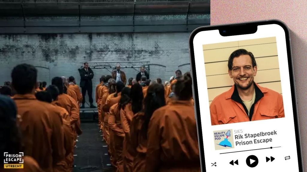 man in orange jumpsuit, medium brown hair parted on the side, smiling, standing against a wall with horizontal lines. larger image of many people in orange jumpsuits, lined up and listening to men speaking on stage