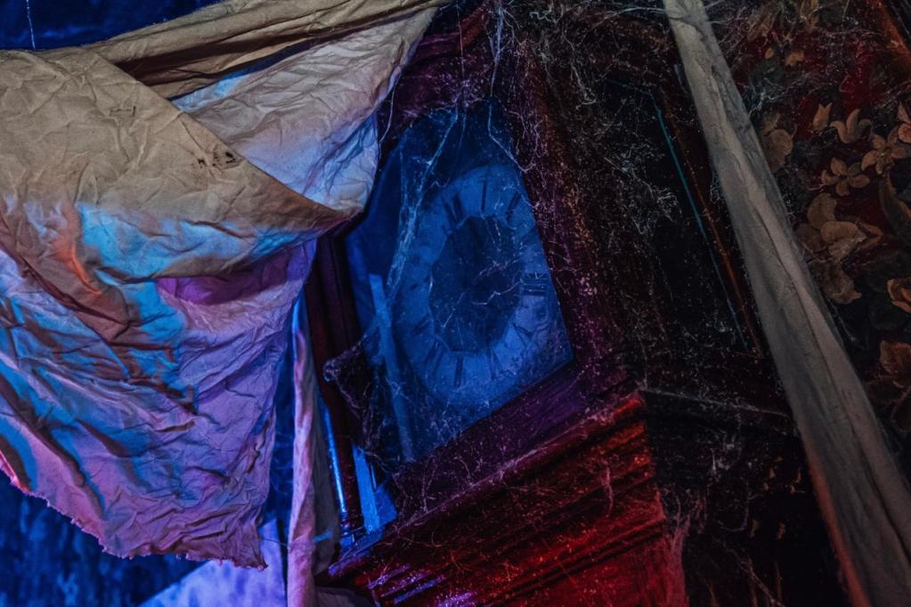 A cobweb-covered grandfather clock