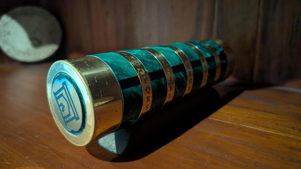 A Justin Nevins green cryptex with a fireplace icon on the end