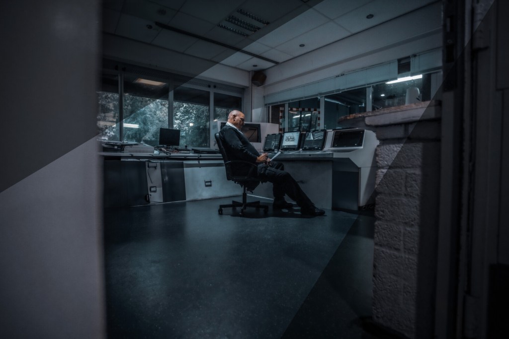 security guard sitting inside a security office